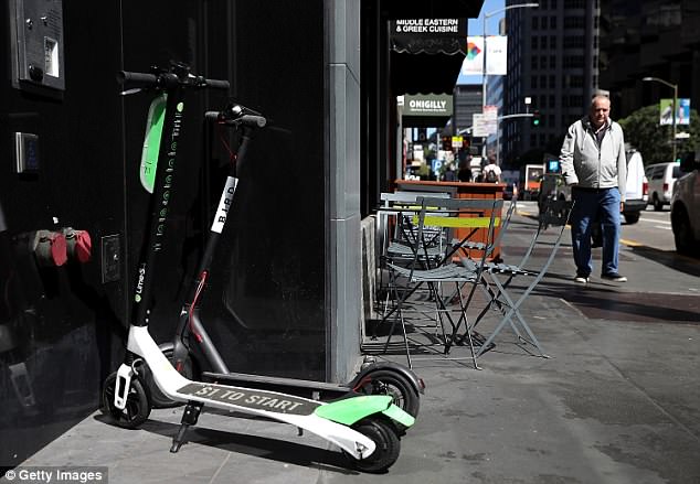 The craze for electronic scooters has blossomed recently, with Lime facing competition from rivals Spin and Bird (pictured here alongside a Lime scooter). Ride-sharing giant Lyft is also reportedly interested in entering the already crowded niche market